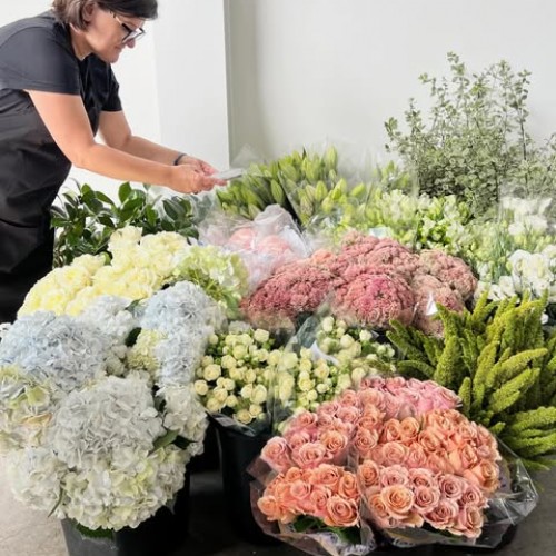 Working with beautiful seasonal blooms fresh from the cool room floor